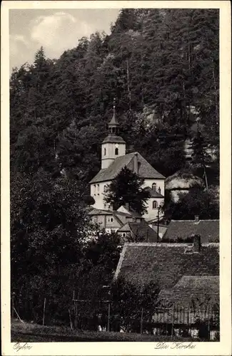 Ak Oybin in Sachsen, Blick auf die Kirche über Häuser hinweg, Wald