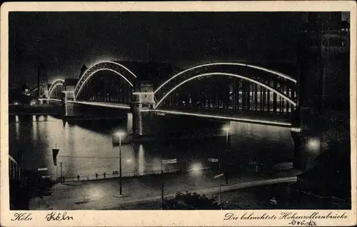 Ak Köln am Rhein, beleuchtete Hohenzollernbrücke