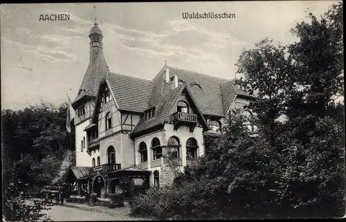 Ak Aachen, Blick auf das Waldschlösschen hinter Bäumen gesehen