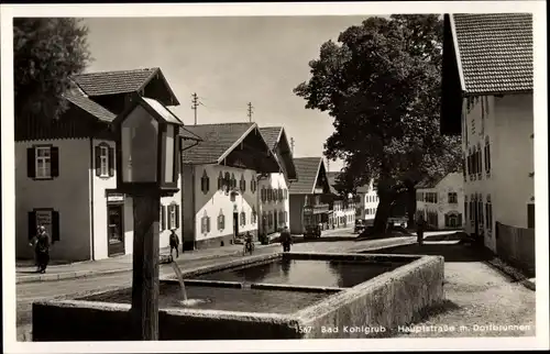 Ak Bad Kohlgrub Oberbayern, Hauptstraße m. Dorfbrunnen