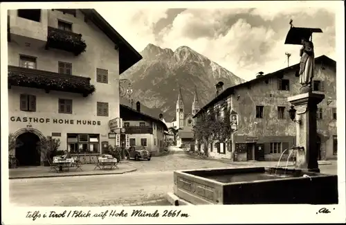 Ak Telfs in Tirol, Blick auf Hohe Münde, Gasthof, Brunnen