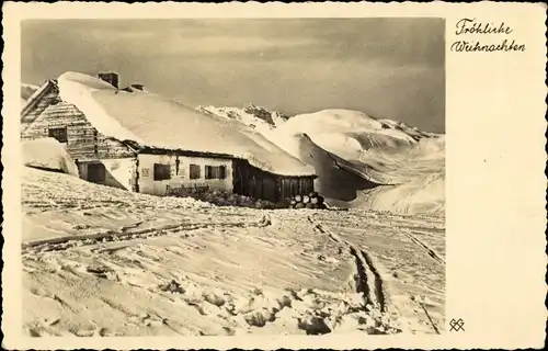 Ak Fröhliche Weihnachten, Alpengasthaus im Winter, Berghütte