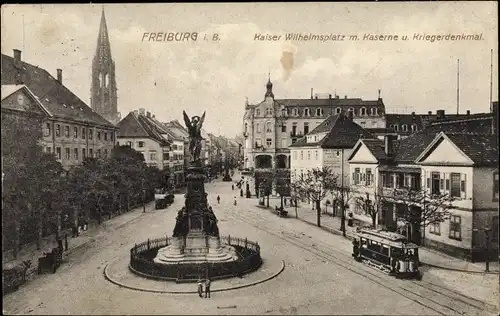 Ak Freiburg im Breisgau Baden Württemberg, Kaiser Wilhelm Platz, Kaserne, Kriegermal, Straßenbahn