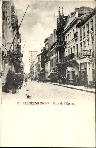 Ak Blankenberge Westflandern, Rue de l'Eglise, Straße mit Geschäften