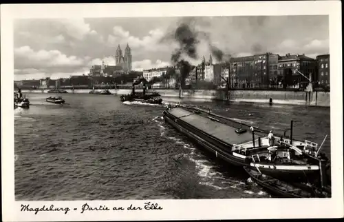 Ak Magdeburg an der Elbe, Salondampfer und Frachtschiffe auf der Elbe