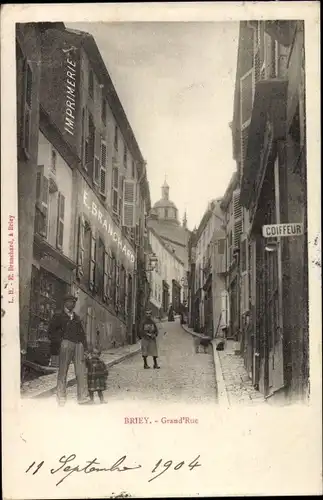 Ak Briey Meurthe et Moselle, Grand'Rue, Coiffeur, Imprimerie