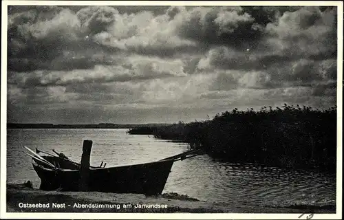 Ak Unieście Nest Pommern, Abendstimmung am Jamundsee, Ruderboot