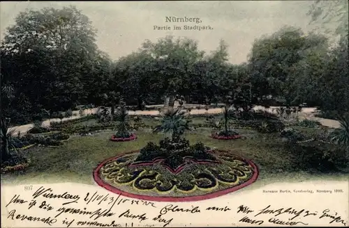 Ak Nürnberg in Mittelfranken, Partie im Stadtpark, Blumenrabatten
