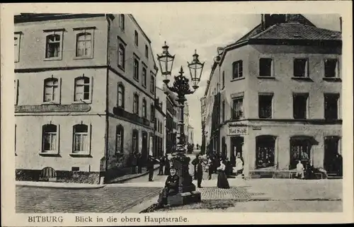 Ak Bitburg Eifel Rheinland Pfalz, Blick in die obere Hauptstraße, Buchbinderei, Inh. Karl Schilz