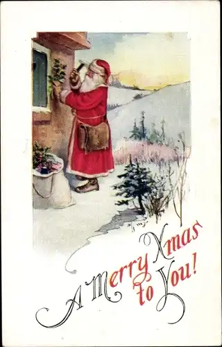 Ak Glückwunsch Weihnachten, Weihnachtsmann nagelt Stechpalmenzweige an Hauswand