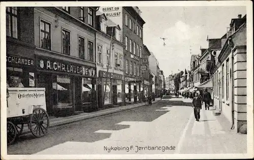 Ak Nykøbing Falster Dänemark, Jernbadegade, Österbro Mejeri, Milchwagen, Geschäfte