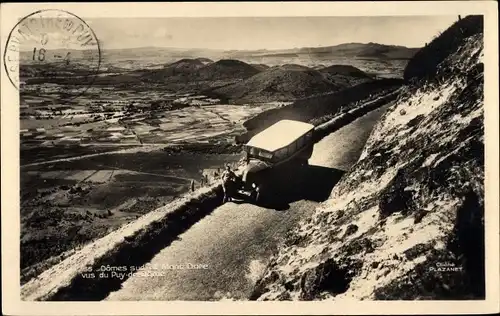 Ak Le Mont Dore Puy de Dôme, Autobus auf einer Gebirgsstraße