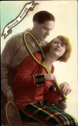 Ak Glückwunsch Neujahr, Bonne Année, Paar mit Tennisschlägern