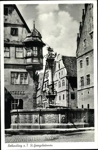 Ak Rothenburg ob der Tauber Mittelfranken, St. Georgsbrunnen, Apotheke