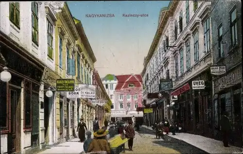Ak Nagykanizsa Großkirchen Ungarn, Kazinczy utca, Geschäfte, Straßenpartie