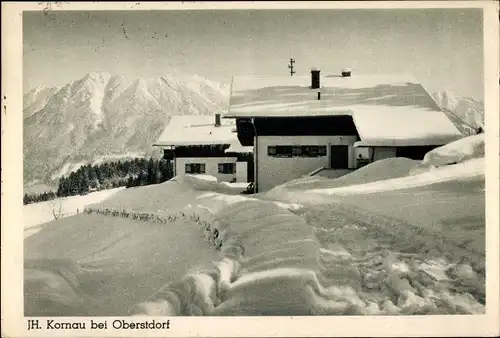 Ak Kornau Oberstdorf im Oberallgäu, Ortsansicht, Wohnhaus, Winterszene