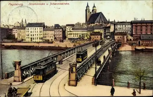 Ak Magdeburg an der Elbe, Straßenbahnen auf der Strombrücke und Johanniskirche