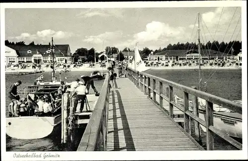 Ak Ostseebad Grömitz in Holstein, Landungsbrücke, Strand, Promenande