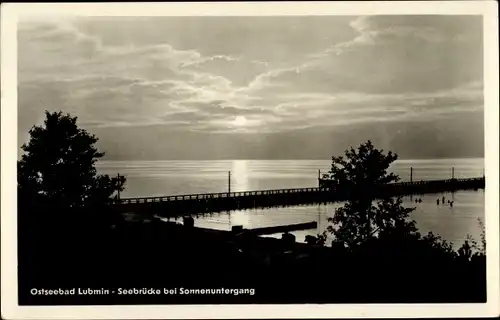 Ak Ostseebad Lubmin in Pommern, Seebrücke bei Sonnenuntergang