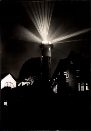 Ak Nordseebad Wangerooge in Ostfriesland, Leuchtturm bei Nacht
