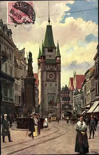 Künstler Ak Hoffmann, H., Freiburg im Breisgau, Kaiserstraße mit Martinstor