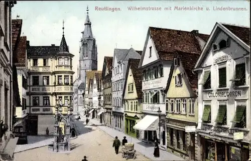Ak Reutlingen in Württemberg, Wilhelmstraße mir Marienkirche und Lindenbrunnen,Kolonialwarenhandlung