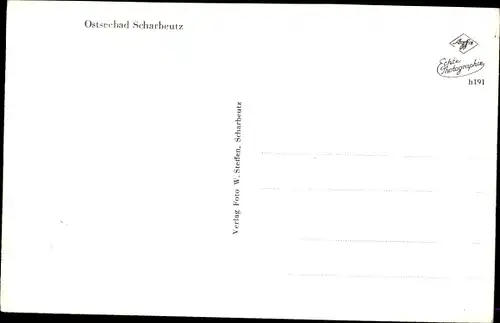Ak Ostseebad Scharbeutz in Ostholstein, Partie im Ort, Meer, Bäume, Häuser