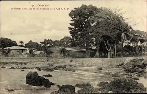 Ak Conakry Konakry Guinea, Boulevard Circulaire et les Magasins de la Cie FAO