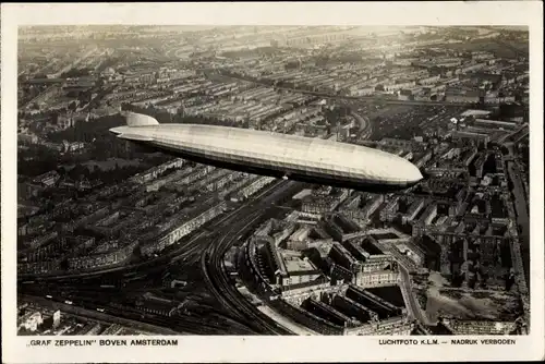Ak Amsterdam Nordholland Niederlande, Luftschiff LZ 127 Graf Zeppelin über der Stadt