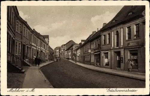 Ak Malchow in Mecklenburg, Güstrower Straße mit Geschäften, Passanten