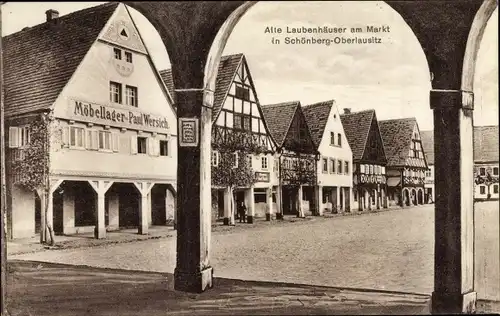 Ak Sulików Schönberg Oberlausitz Schlesien, alte Laubenhäuser am Markt, Möbellager Paul Wersich