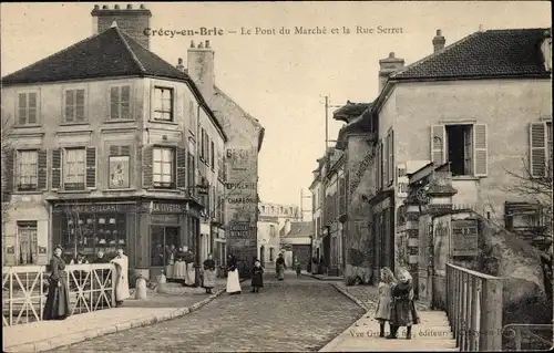 Ak Crecy en Brie Seine et Marne, Le Pont du Marché et la Rue Serret