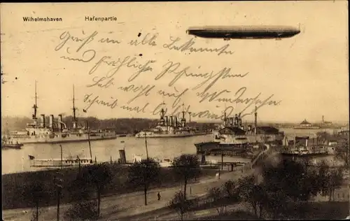 Ak Wilhelmshaven in Niedersachsen, Deutsche Kriegsschiffe, Luftschiff, Zeppelin, Hafenpartie