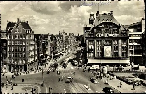 Ak Amsterdam Nordholland Niederlande, Damrak, Straßenbahnen, Autos, De Buenkorf