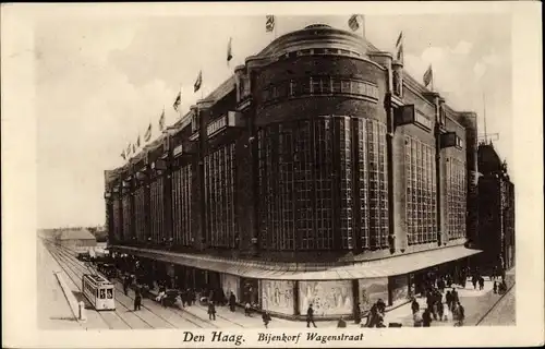 Ak Den Haag Südholland Niederlande, Bijenkorf Wagenstraat, administratives Gebäude, Straßenbahn