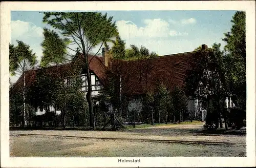 Ak Heimstatt Freistatt in Niedersachsen, Blick von der Straße auf ein großes Bauernhaus, Garten