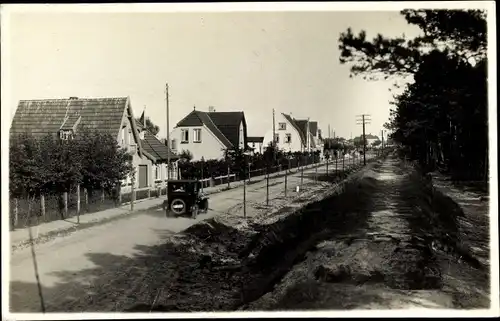 Foto Ak Nordseebad Sankt Peter Ording, Straßenpartie, Fluss, Auto, Häuser