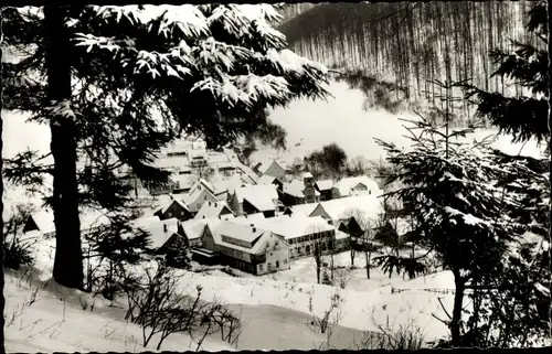 Ak Lonau Herzberg am Harz, Blick auf den verschneiten Ort, Winter