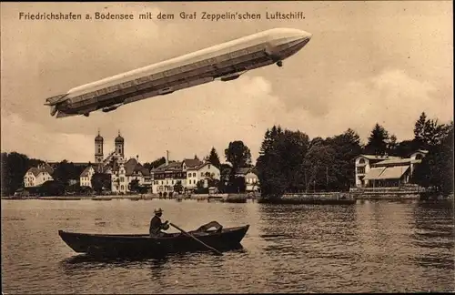 Ak Friedrichshafen am Bodensee, Zeppelin, Ruderboot, Blick auf den Ort