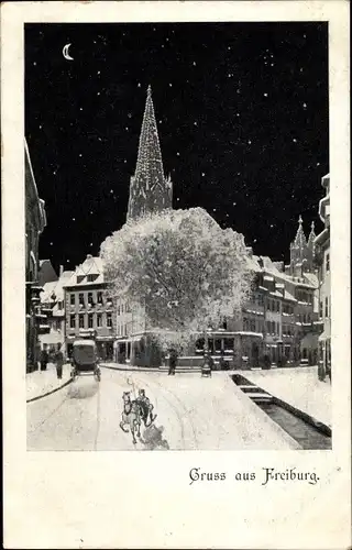 Ak Freiburg im Breisgau, Straßenpartie bei Nacht, Pferdeschlitten