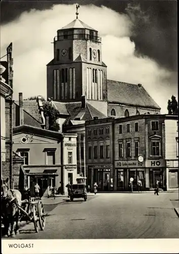 Ak Wolgast in Mecklenburg Vorpommern, Straßenpartie mit Kirche und HO Handlung