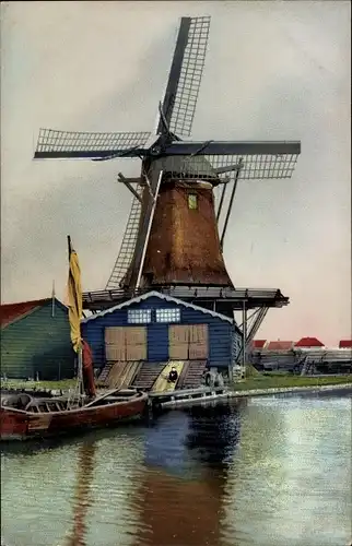 Ak Niederlande, Windmühle am Ufer, Boot