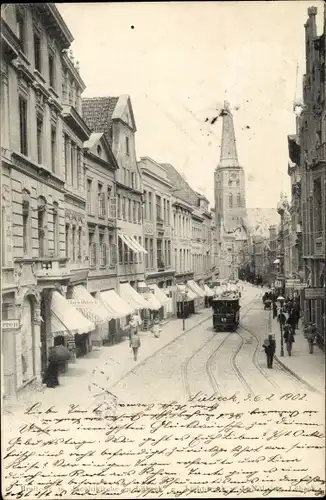 Ak Lübeck in Schleswig Holstein, Breitestraße, Straßenbahn, Kirche, Geschäfte