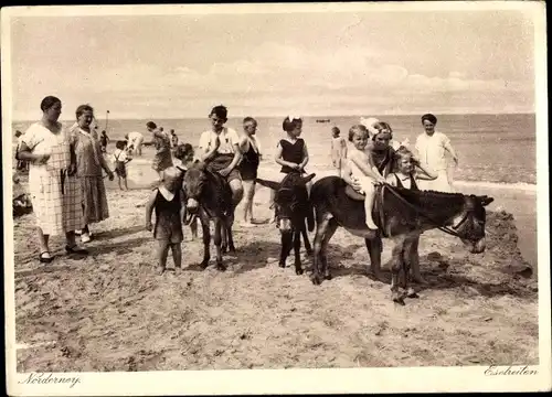 Ak Norderney, Eselreiten am Strand mit Blick aufs Meer