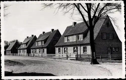 Foto Ak Tönning an der Eider Nordfriesland, Straßenpartie mit Wohnhäusern