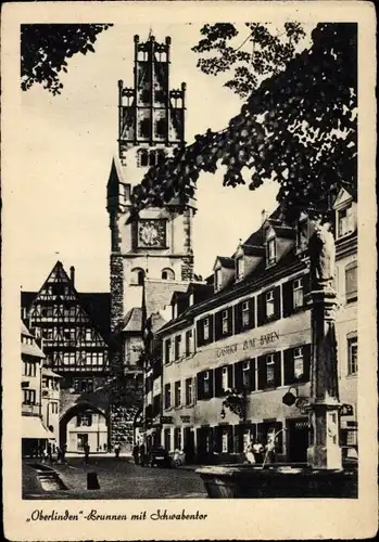 Ak Freiburg im Breisgau, "Oberlinden"-Brunnen mit Schwabentor, Turm mit Uhr