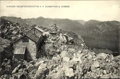 Ak Wettersteingebirge, Wiener Neustädter Hütte, auf der Zugspitze gegen Eibsee