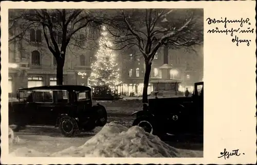 Ak Graz Steiermark, Straßenpartie zur Weihnachtszeit, beleuchteter Tannenbaum, Auto