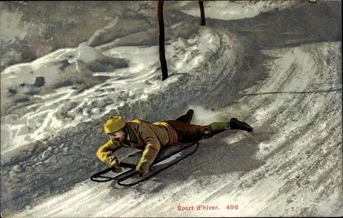 Ak Sport d'hiver, Mann auf einem Schlitten bei der Abfahrt