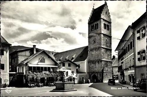 Ak Zell am See in Salzburg, Stadtplatz, Kirche, Fotohaus, Cafe Konditorei, Brunnen